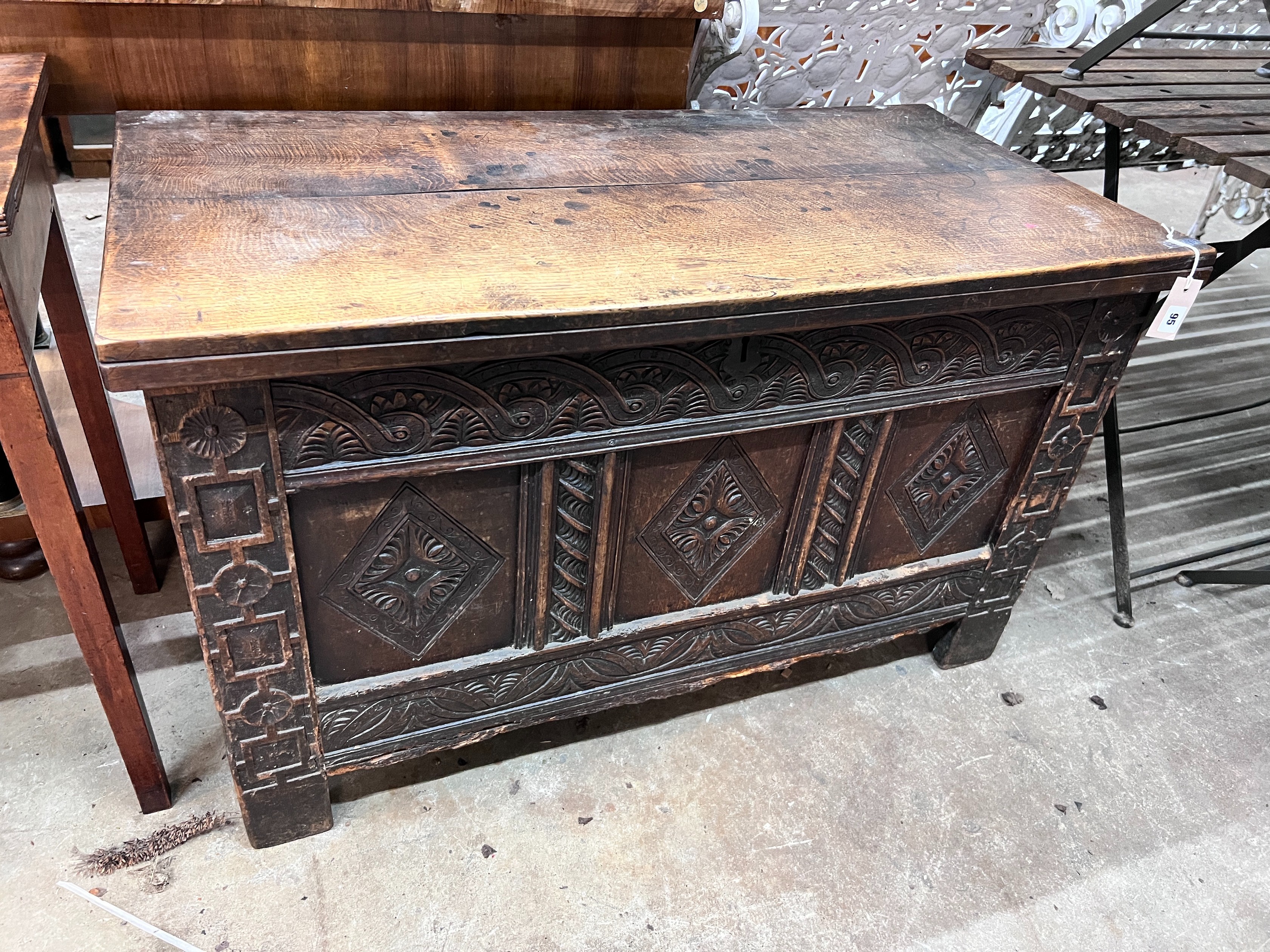 An 18th century and later carved oak coffer, width 108cm, depth 54cm, height 66cm *Please note the sale commences at 9am.